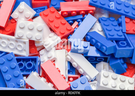 Pile of Red, White and Blue Toy Plastic Building Blocks. Stock Photo