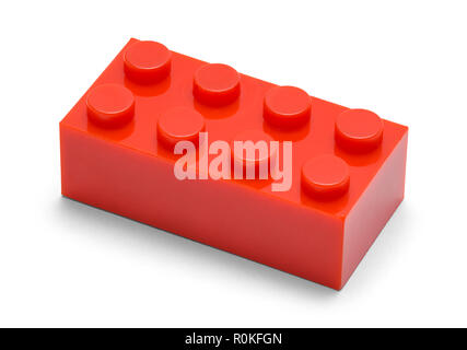 Single Red Plastic Brick on a White Background. Stock Photo