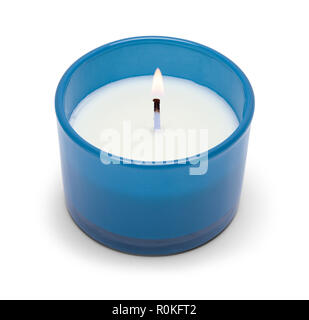 Small Lit Candle in Blue Glass Isolated on a White Background. Stock Photo