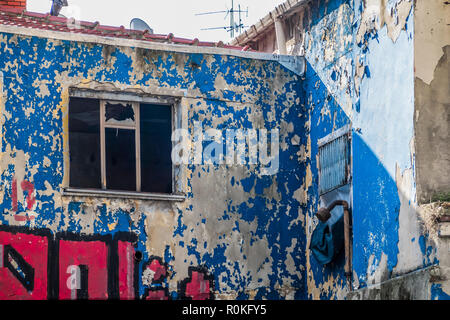 Shabby facade with flaking paint in the city centre Stock Photo