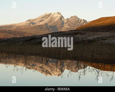 A still sunrise on the Isle of Skye. This was taken from the still waters of Loch Cill Chriosd looking to Blaven and its reflection Stock Photo