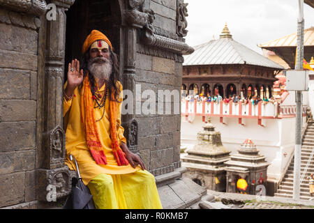 A Sadhu sits in one of the temples at the Pashupatinath temple complex, Kathmandu, Nepal Stock Photo