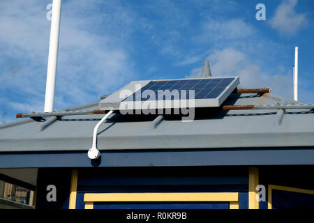 Solar energy electrical panel on coastguard station roof on UK east coast. Stock Photo