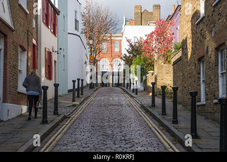 Back Lane, a pretty, narrow, cobbled street of houses in Hampstead, London, England, UK Stock Photo