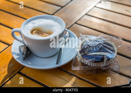 A cup of coffee with chocolate canabis muffin on the taible in the coffee shop, Amsterdam Stock Photo