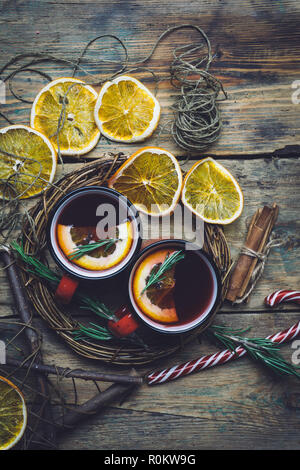 Christmas drink (winter hot drink). Mulled wine punch and spices for glintwine on vintage wooden table background top view. Stock Photo