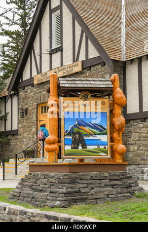 BANFF, AB, CANADA - JUNE 2018: Large sign with wood carvings for Banff National Park outside the Tourist Information Centre in  Banff town centre. Stock Photo