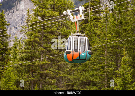 BANFF, AB, CANADA - JUNE 2018: Cable car gondola travelling up Sulphur Mountain in Banff. Stock Photo