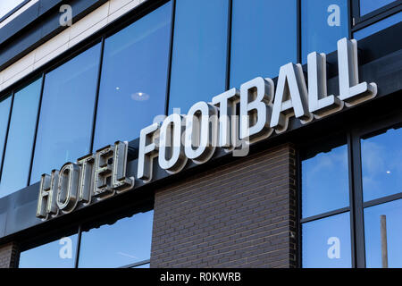 Sign on the Hotel Football building near Old Trafford in Manchester. Owned by former players Gary Neville and Ryan Giggs