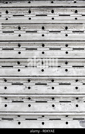 Rusty metallic grating, detail of an old fence down and dirty, ruin and loneliness, textured background Stock Photo