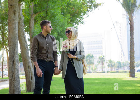 A young Middle Eastern couple in park outdoor scenery Stock Photo