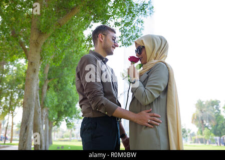 A young Middle Eastern couple in garden outdoor scenery Stock Photo