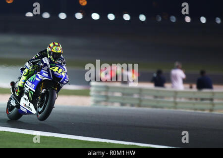 Italian MotoGP rider Valentino Rossi of the Movistar Yamaha MotoGP team steers his bike during a final session of the Moto GP World Championship at the Losail International Circuit. Stock Photo