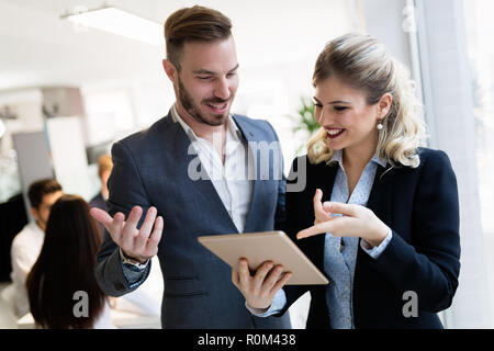 Young attractive architects using digital tablet in office Stock Photo