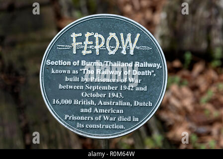 A plaque of the FEPOW (Far East Prisoners of War) close to the short rail track, as part of a World War 11 memorial to allied prisoners of war, who di Stock Photo