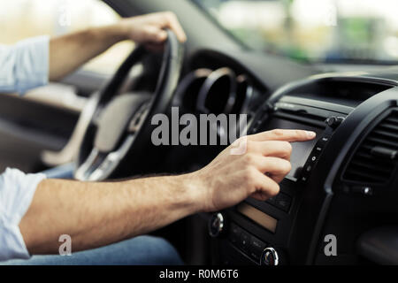 Man Using Gps Navigation System In Car to travel Stock Photo