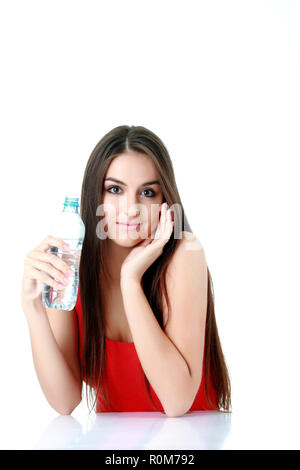 healthy eating, drinks, diet, detox and people concept - close up of woman with fruit water in glass bottle Stock Photo