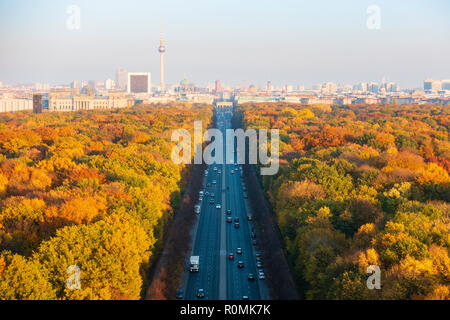 Berlin, Germany. 6 November, 2018. Spectacular late autumn colours of trees in Berlin's famous Tiergarten park in the centre of the city. The Brandenburg Gate and TV Tower are in the far distance. Credit: Iain Masterton/Alamy Live News