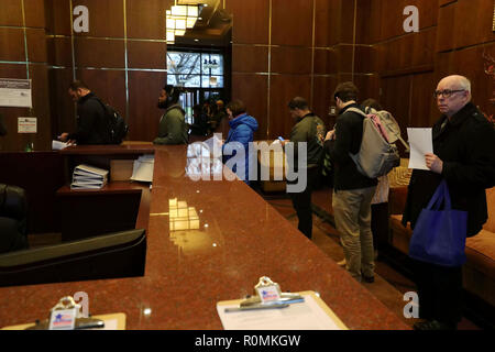 Chicago, USA. 06th Nov, 2018.  Voters queue to cast their ballots in a polling station in Chicago, the United States, on Nov. 6, 2018. U.S. voters began to cast their ballots in the midterm elections as the first polling stations opened Tuesday morning. Credit: Wang Ping/Xinhua/Alamy Live News Stock Photo