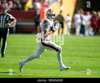 San Francisco 49ers tight end George Kittle (85) stiff-arms Los Angeles  Rams cornerback Marcus …