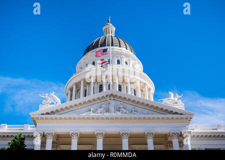 September 22, 2018 Sacramento / CA / USA - The US, the California state and the POW-MIA flags waving in the wind in front of the dome of the Californi Stock Photo