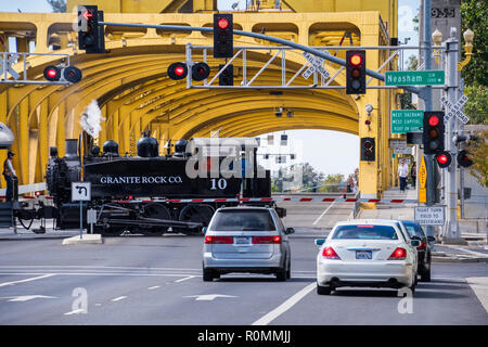 September 22, 2018 Sacramento / CA / USA - The  Granite Rock steam engine locomotive pulling cars full of tourists in downtown Sacramento; Stock Photo