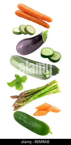 Fresh flying vegetables ingredients isolated on a white background. Stock Photo
