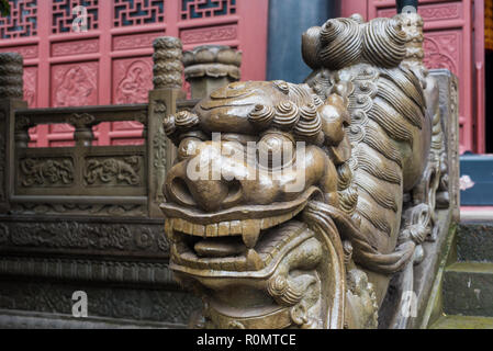 Lion stone statue on a temple stairs in Chongqing, China Stock Photo