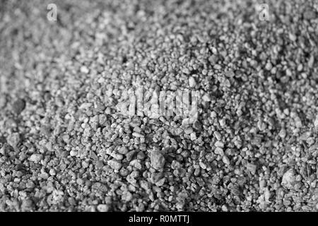 Closeup of sand on the beach. Crystals of sea sand as background. Macro black and white photo Stock Photo