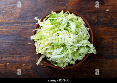 chopped Pekinese cabbage on a wooden background. place for text Stock Photo