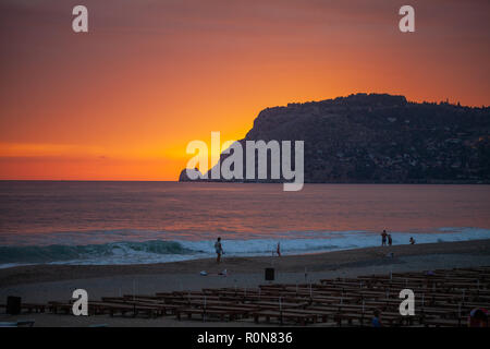 ALANYA / TURKEY - SEPTEMBER 30, 2018: A beautiful sunset scene on Alanya beach in Turkey Stock Photo