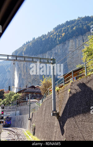 View of Staubbachfall waterfall from train heading for Kleine Scheidegg at trainstation Lauterbrunnen, Jungfrau Region, Switzerland Stock Photo