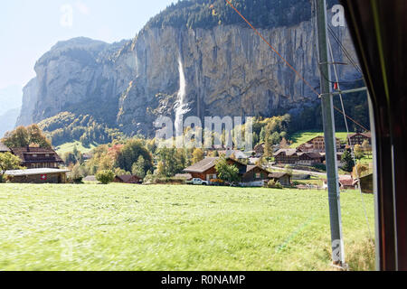 View of Staubbachfall waterfall from train heading for Kleine Scheidegg, Jungfrau Region, Switzerland Stock Photo