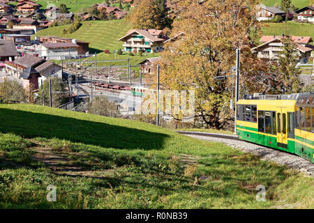 Train approaching Grindelwald Grund trainstation, Jungfrau Region, Switzerland Stock Photo