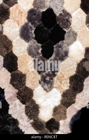 Close up fur carpet made of black, grey and white parts Stock Photo