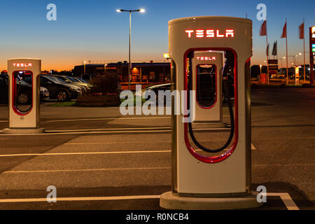 Stockholm, Sweden - September 13, 2018: Modern Tesla supercharger at night near Stockholm. Sweden. Stock Photo