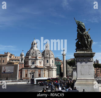 Piazza Venezia is the central hub of Rome, Italy, in which several thoroughfares intersect. There are many Monuments dedicated to the Roman Empire. Stock Photo