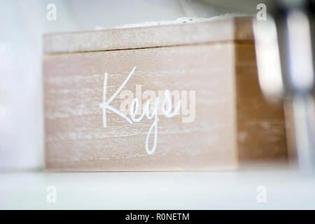 Wooden box with the inscription "keys" on one side. Blurred deep of field Stock Photo