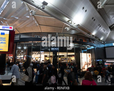 ISTANBUL, TURKEY - SEPTEMBER 27, 2018: People crowd at HUGO BOSS store at Istanbul Airport Stock Photo