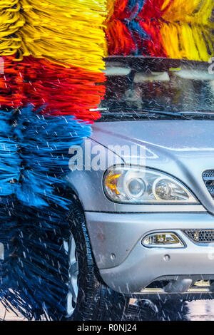 Car going through an automated car wash machine. Stock Photo