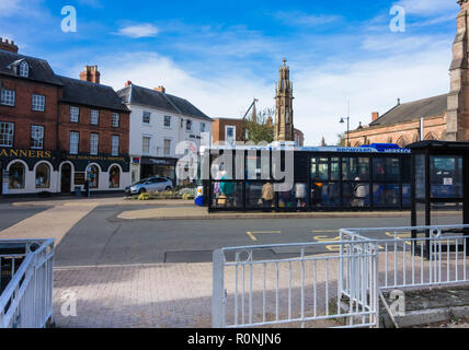 Pensioners queuing to board a bus St. Peter's square Hereford UK Stock Photo