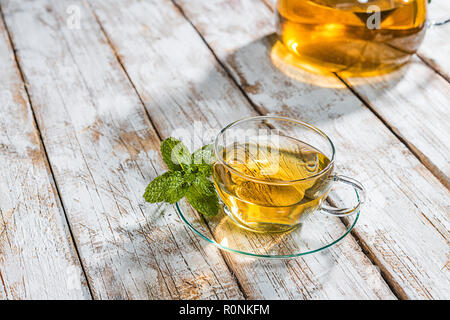 Glass cup with tea on wooden table Stock Photo
