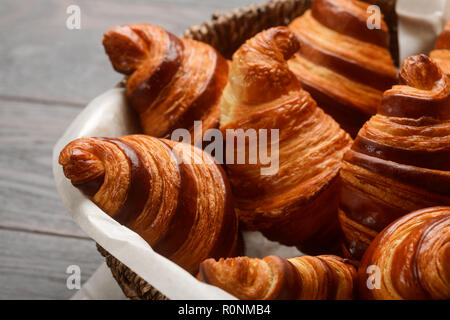 French croissants in wicker basket Stock Photo