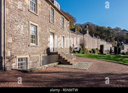 Robert Owen's house (l) with millworkers house (r) at New Lanark Mills World Heritage Site by the River Clyde in Lanark Lanarkshire Scotland UK Stock Photo