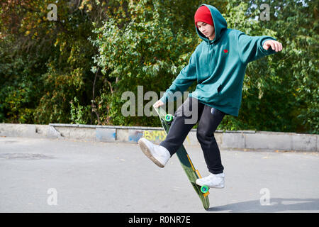 Young Man Doing Skating Stunts Stock Photo