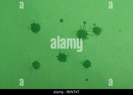 Green ink blots on green background close-up Stock Photo