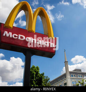 fast food and religion Hounslow Broadway Abubaker Mosque and McDonalds Stock Photo