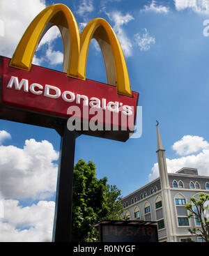 fast food and religion Hounslow Broadway Abubaker Mosque and McDonalds Stock Photo