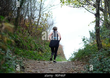 A female jogger in the countryside Stock Photo