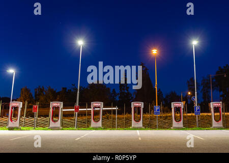 Stockholm, Sweden - September 13, 2018: Modern Tesla supercharger at night near Stockholm. Sweden. Stock Photo